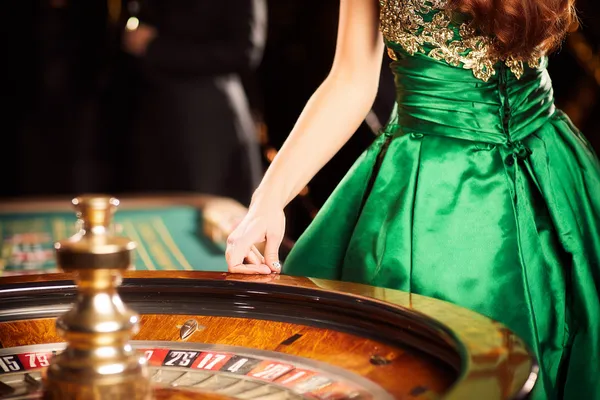 A young woman relaxing with her phone while dynamic casino elements float around her, illustrating the smooth mobile experience offered by the LINEBEF app.